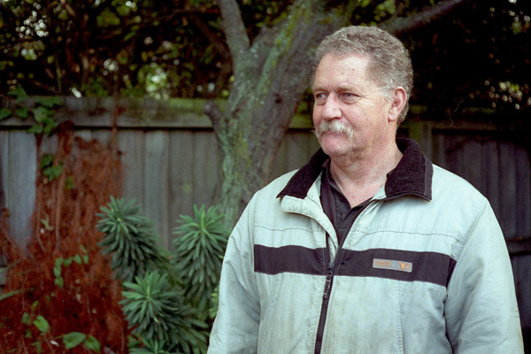 Allan Burgess self-portrait , Christchurch, Canterbury, New Zealand. Photograph taken with Yashica Electro 35 on Fuji Superia 400 ASA film. Negative scanned with Epson 2480 flatbed scanner.