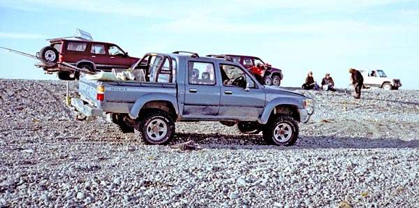Ricoh 500G - Rakaia River Mouth whitebaiter's 4x4 trucks.