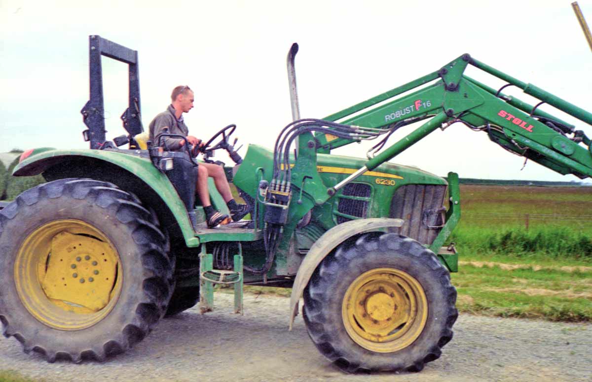 Tractor on farm near Christchurch. Scanned from negative film. Canon Canonet QL19.